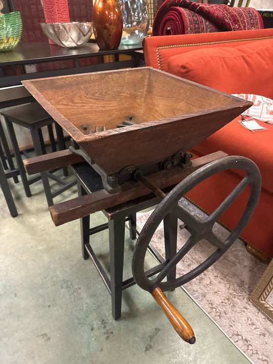 Antique Wine Crusher on Black Wooden Counter Stool